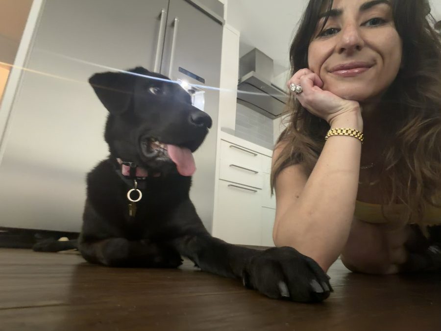 Alex Karam, Owner & Founder of Pet Nannies of Austin, with a client puppy