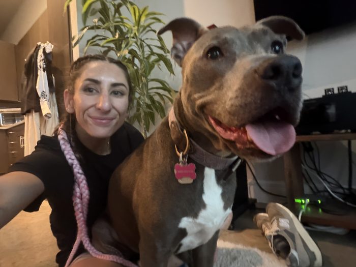 Alex sharing a smile with a dog client